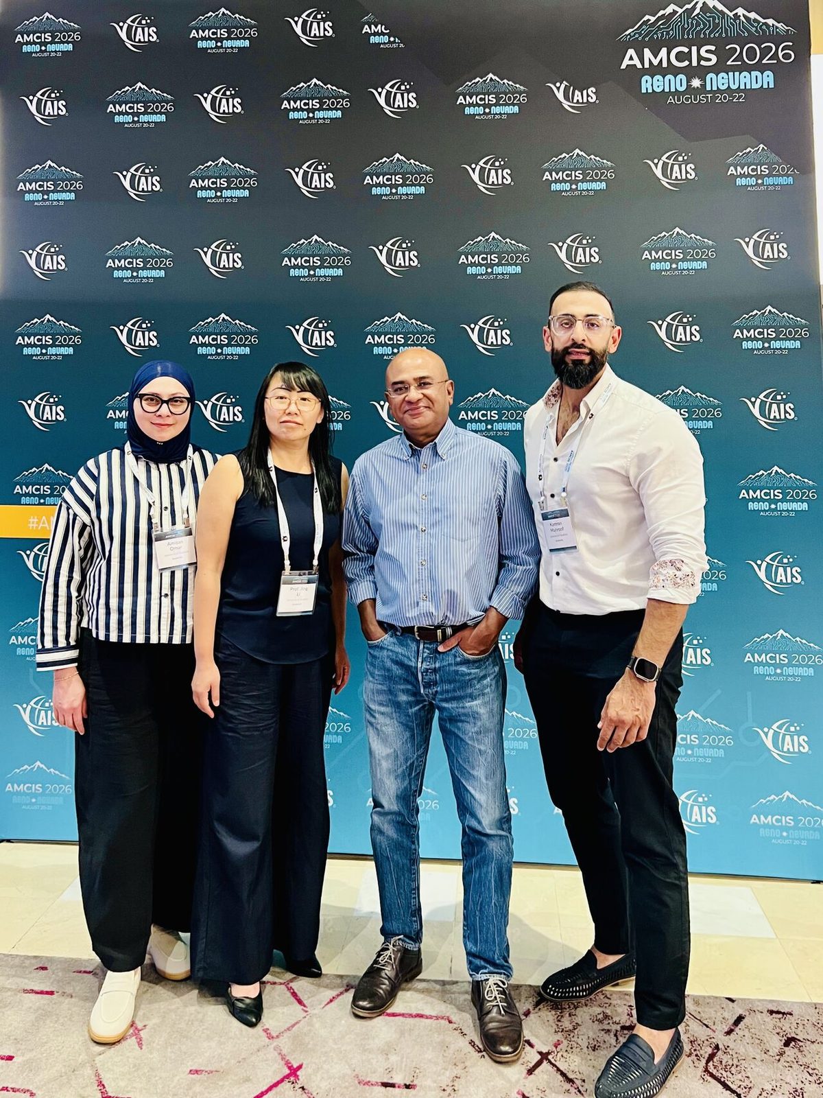 UBRAD and OneSource researchers at the AMCIS 2026 backdrop in Reno, Nevada